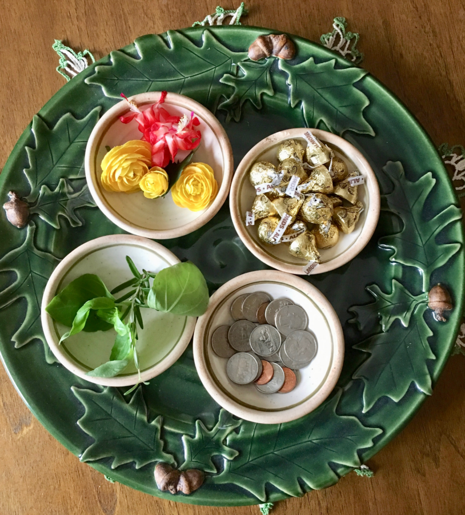 Group ritual, 4 bowls filled with symbols of abundance