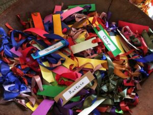 a bowl of assorted encouraging words on colorful cards